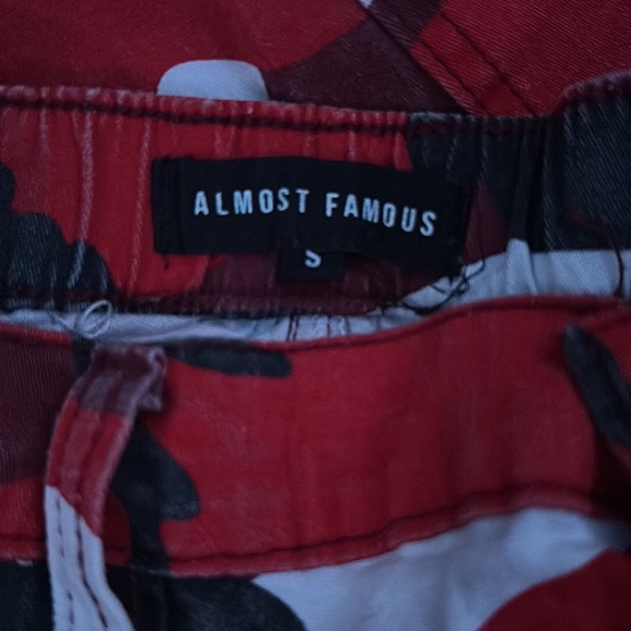 These are red camo print baggy cargo pants. Size small. Only work once. - Picture 2 of 3